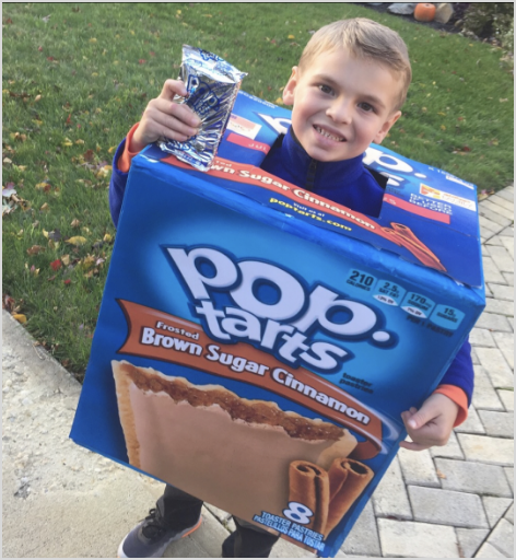 A child wearing a giant Pop-Tart costume holding Pop-Tarts